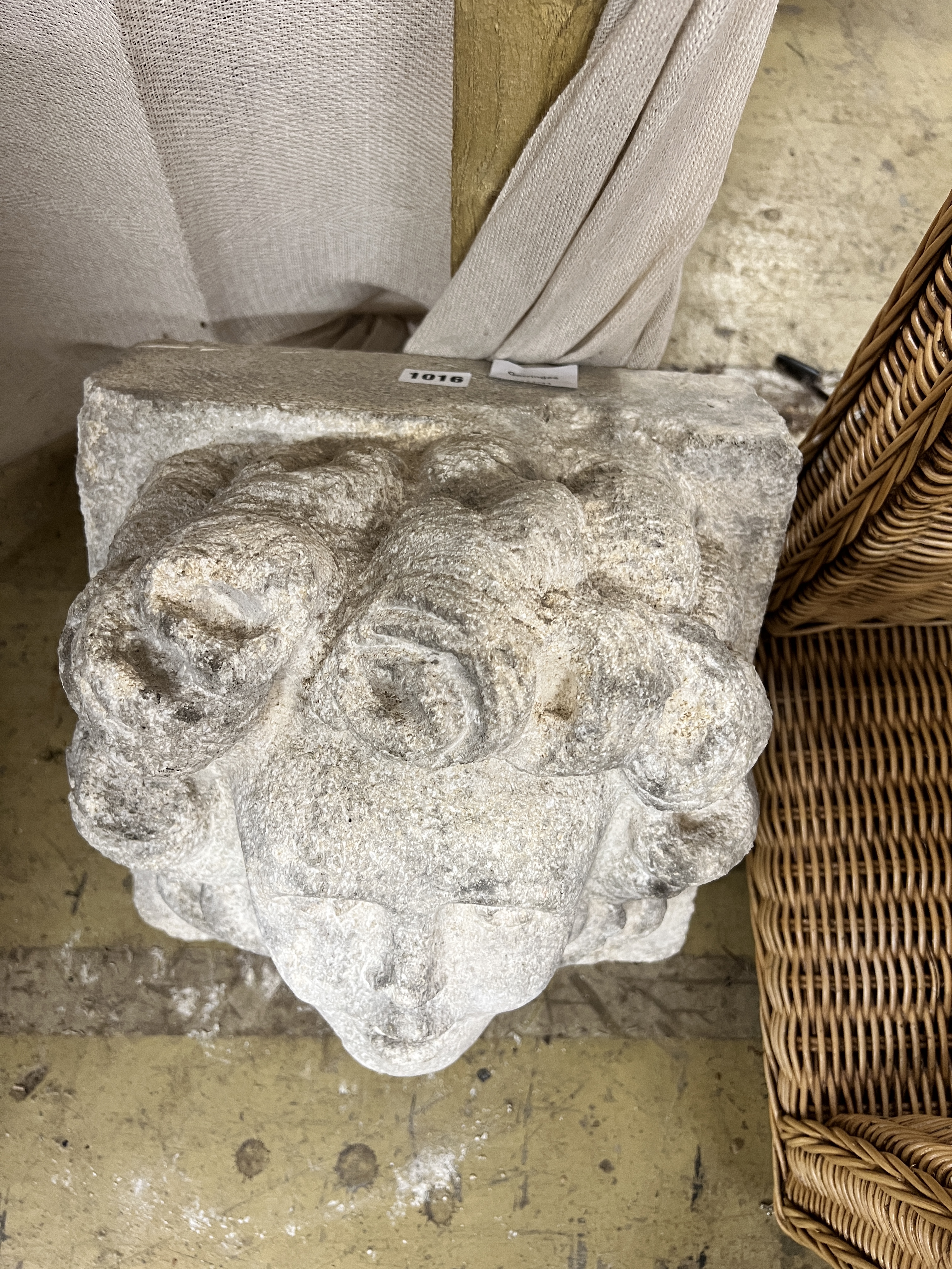 A stone carved corbel, width 30cm, depth 23cm, height 30cm
